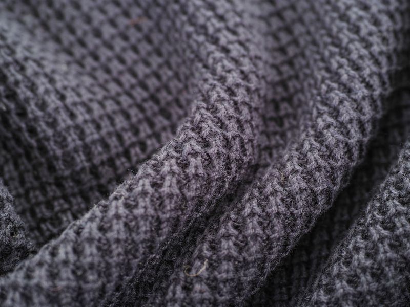 Maille de laine grise vue de très près