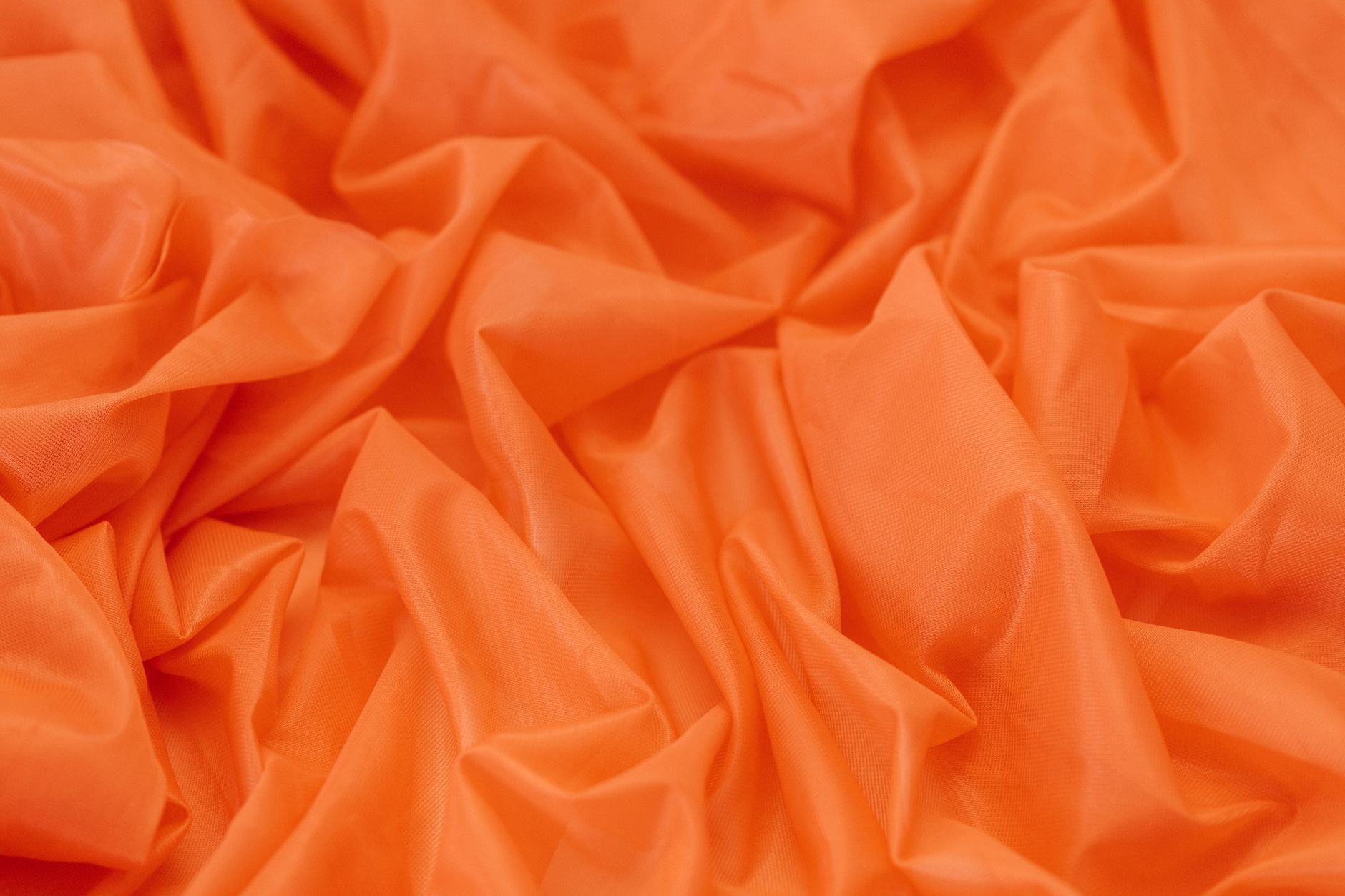 Textile orangé aux ondulations régulières
