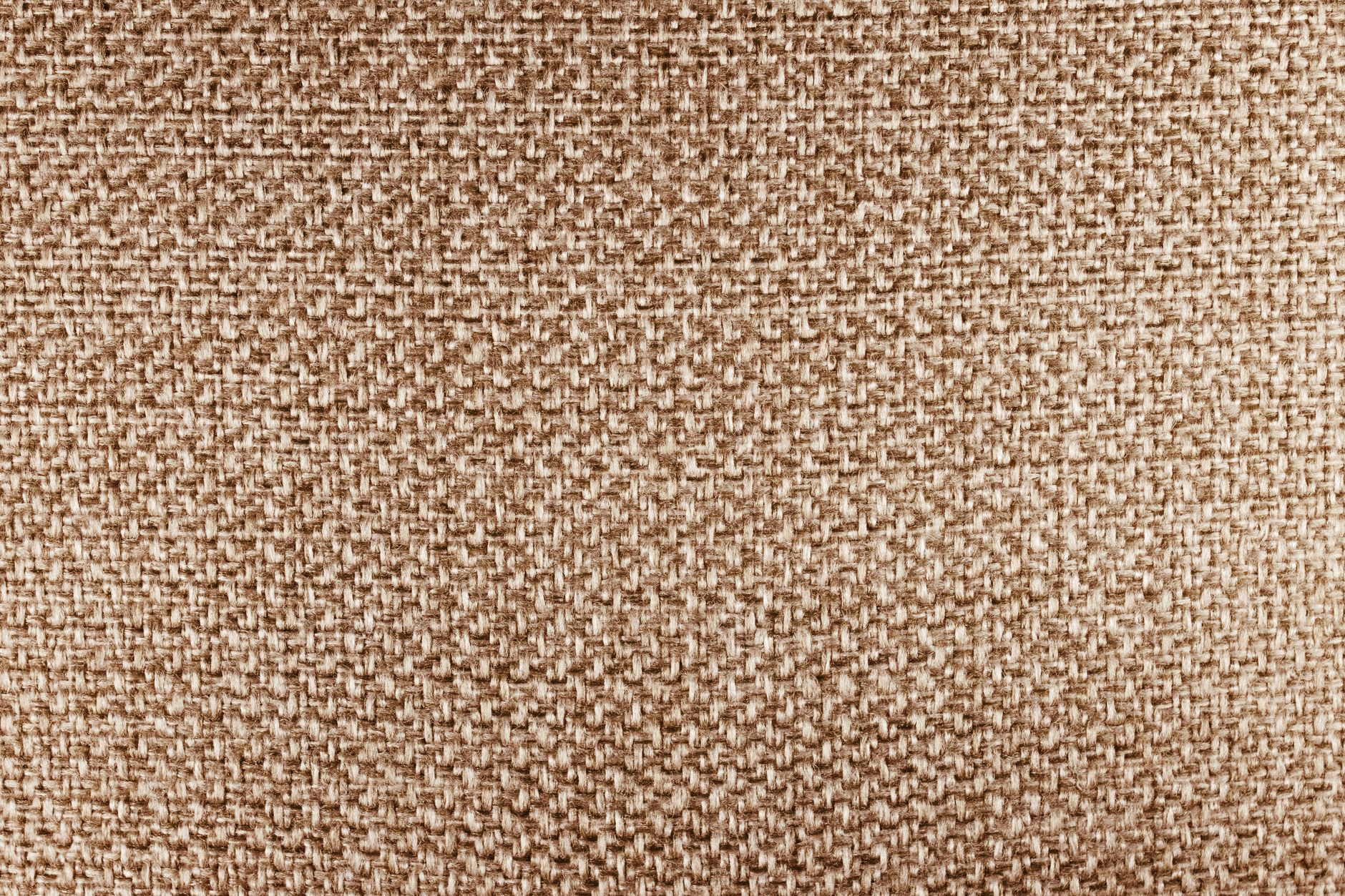 Tissu beige dont la trame se devine de près